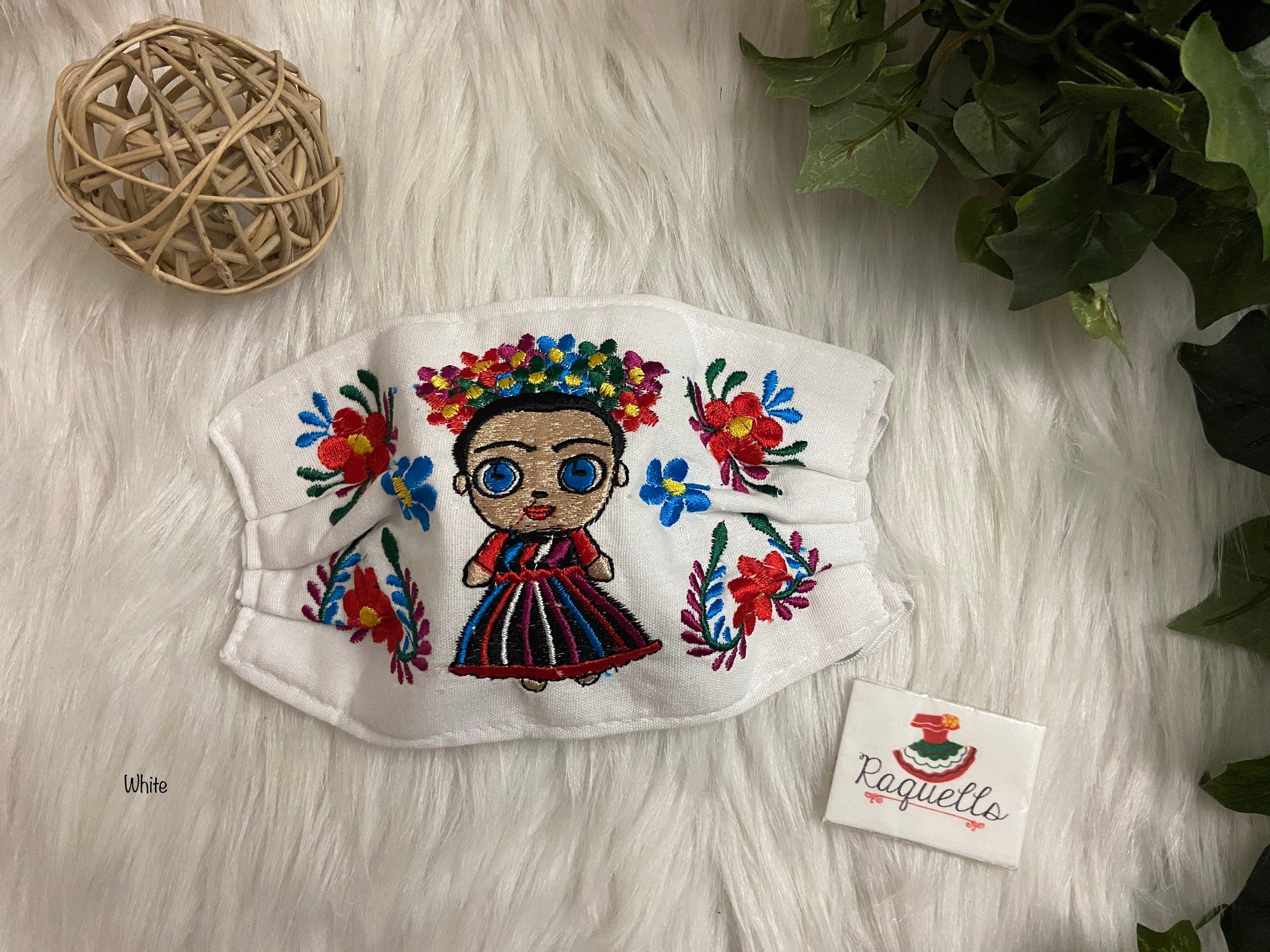 Image of FRIDA Embroidered Face Masks with filter attached