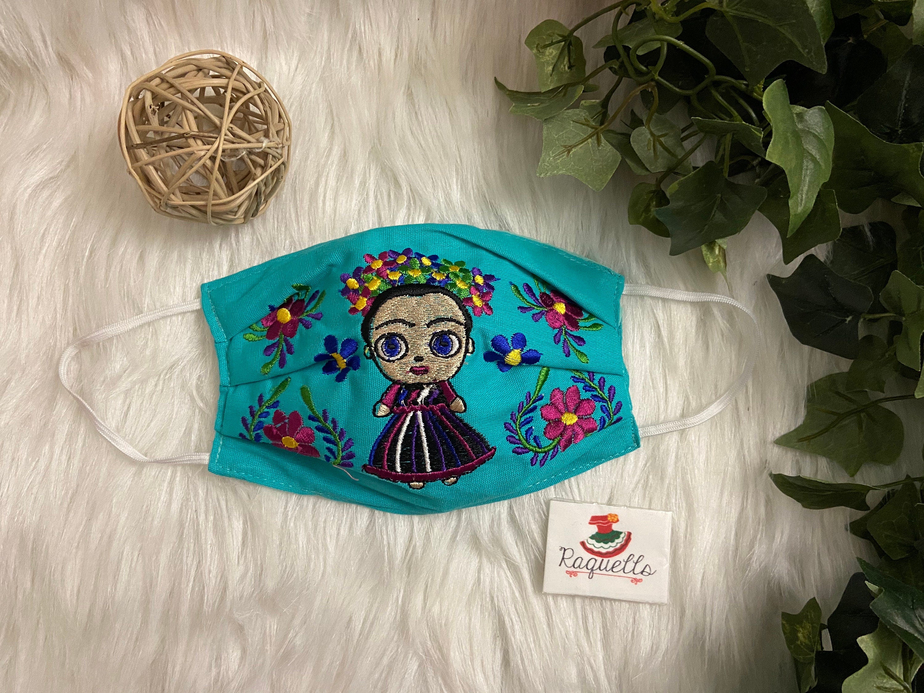 Image of FRIDA Embroidered Face Masks with filter attached