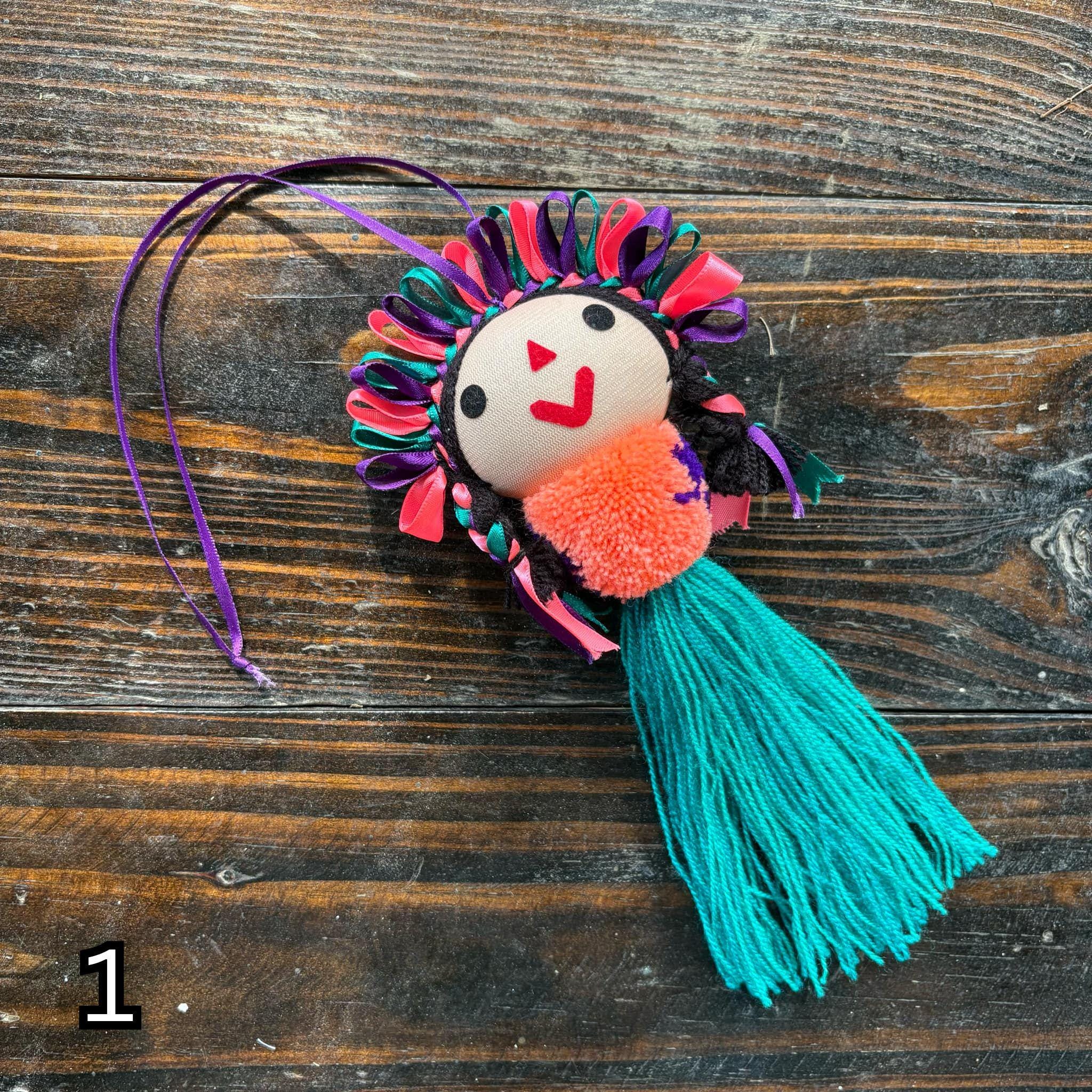 Image of Artisan Tassel Charm Featuring Lele Doll - Playful Addition to Your Everyday Essentials Handmade Tassel Charm-Car Decor, backpack/bag charm