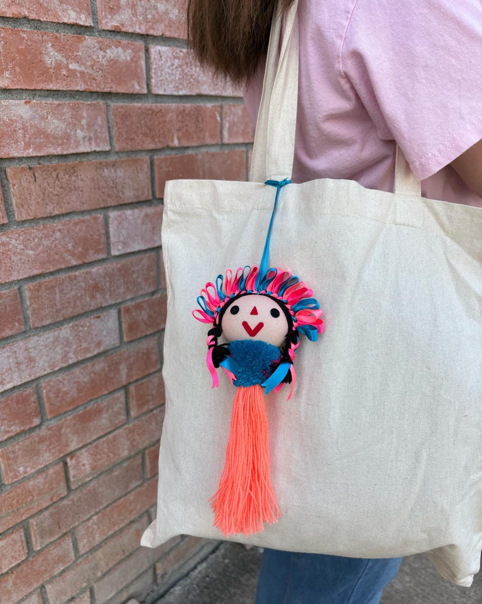 Image of Artisan Tassel Charm Featuring Lele Doll - Playful Addition to Your Everyday Essentials Handmade Tassel Charm-Car Decor, backpack/bag charm