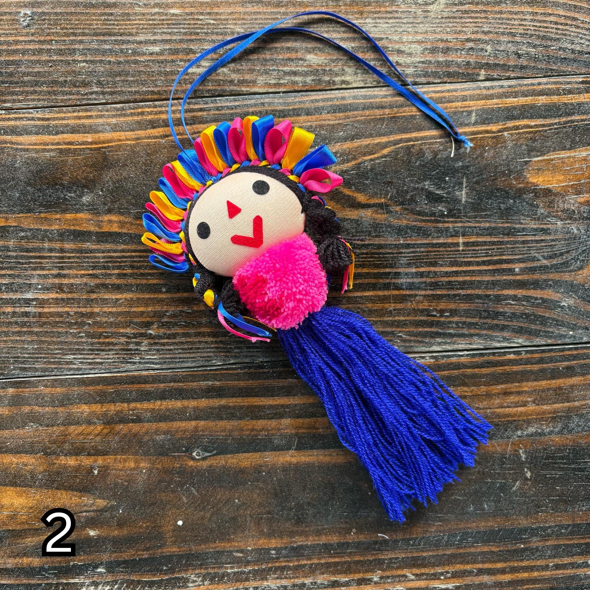 Image of Artisan Tassel Charm Featuring Lele Doll - Playful Addition to Your Everyday Essentials Handmade Tassel Charm-Car Decor, backpack/bag charm