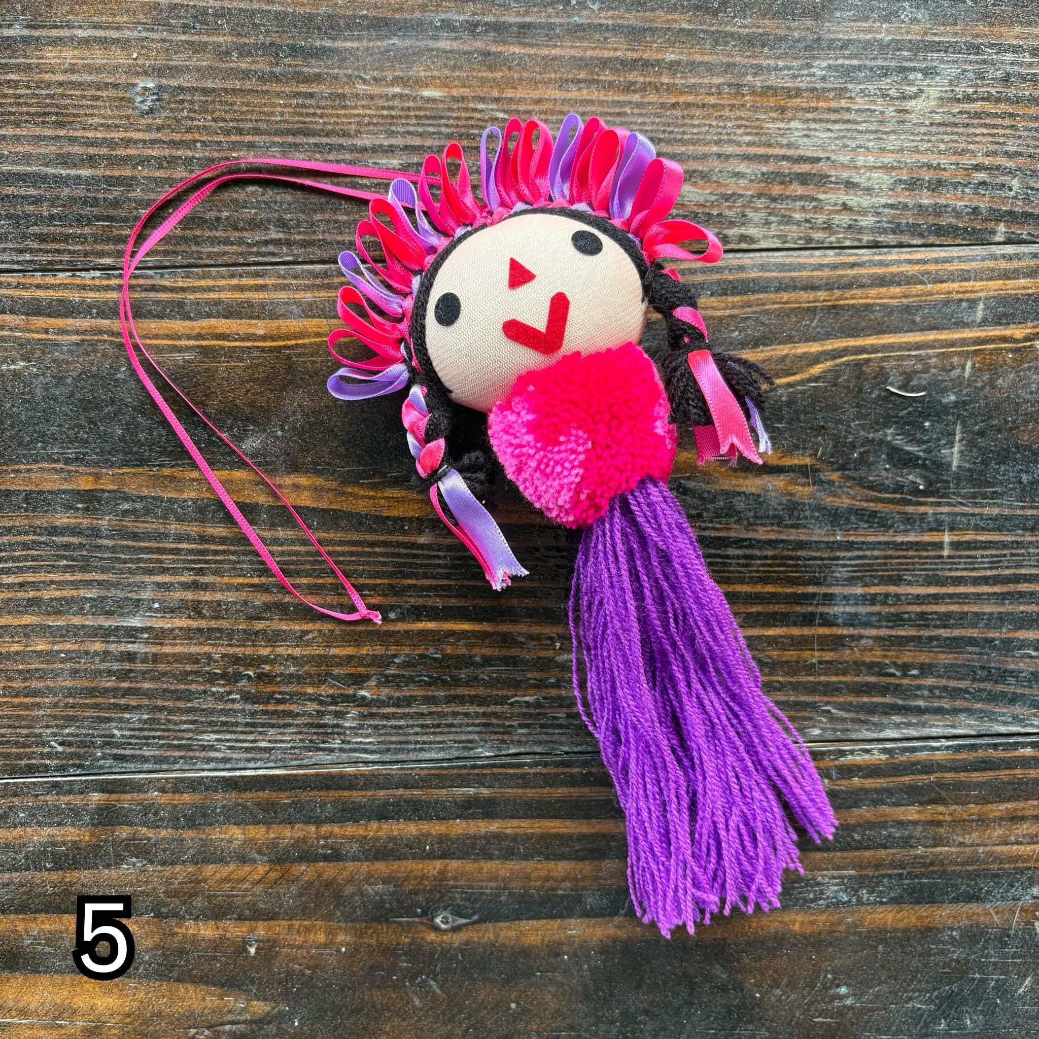 Image of Artisan Tassel Charm Featuring Lele Doll - Playful Addition to Your Everyday Essentials Handmade Tassel Charm-Car Decor, backpack/bag charm